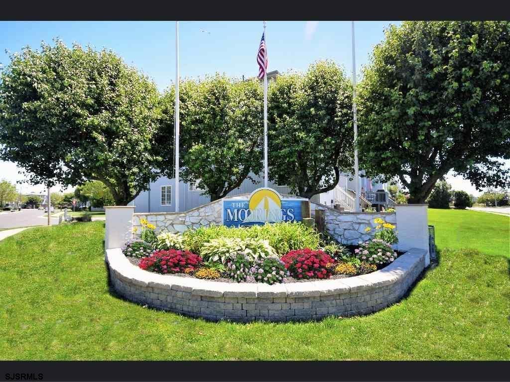 66 Sailfish Drive Brigantine, NJ 08203 - Photo 2 of 24 a view of a garden with a fountain