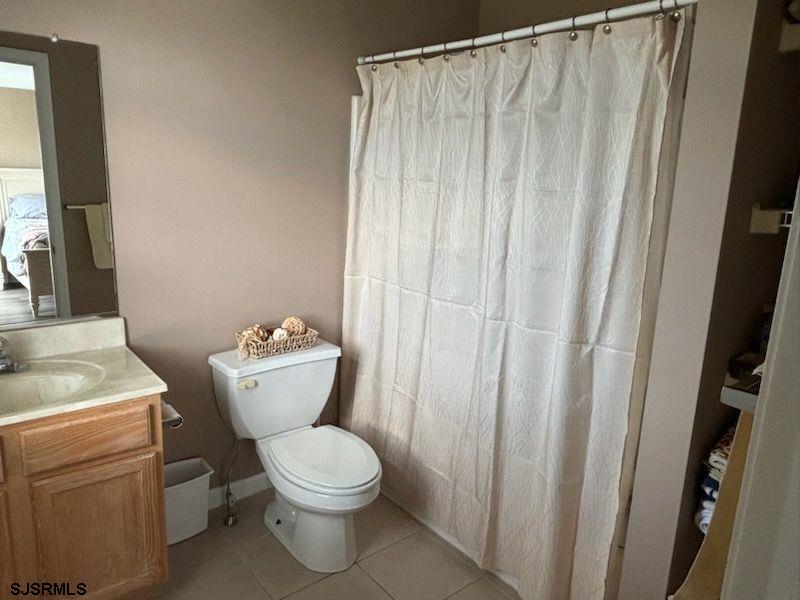 66 Sailfish Drive Brigantine, NJ 08203 - Photo 22 of 24 a view of bathroom with a toilet and a sink