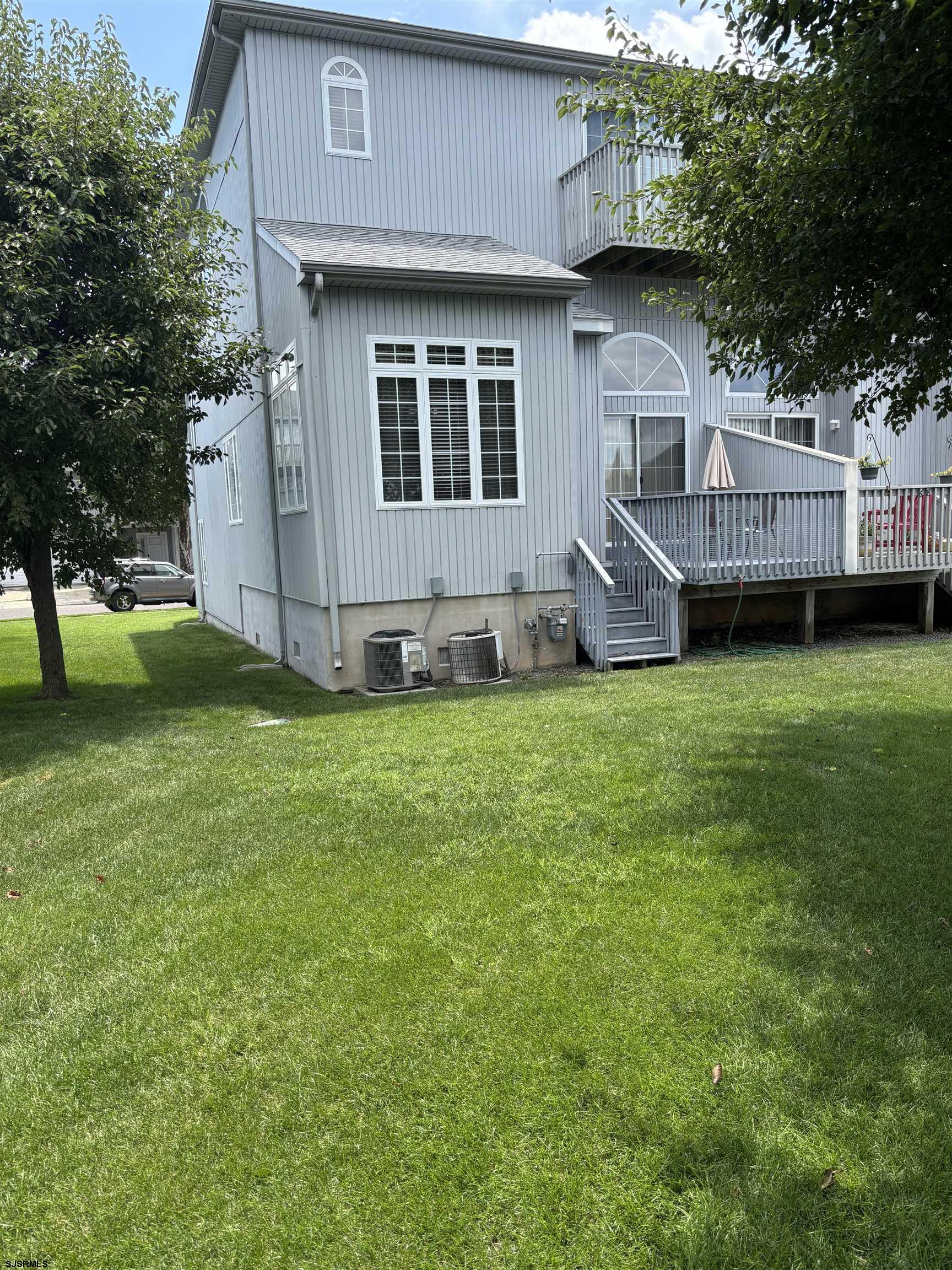 66 Sailfish Drive Brigantine, NJ 08203 - Photo 24 of 24 a view of a house with a yard and sitting area