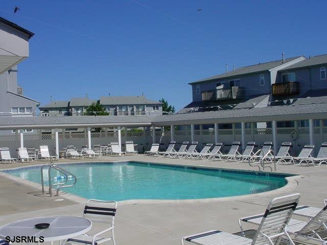 66 Sailfish Drive Brigantine, NJ 08203 - Photo 7 of 24 a view of a house with a swimming pool