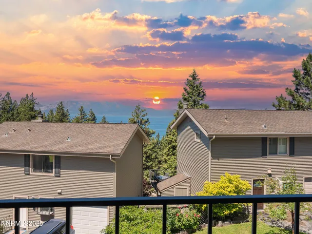 a bedroom with a large bed and a large window