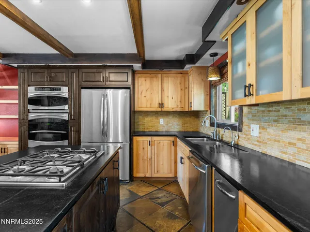 a view of a dining room with furniture and a chandelier