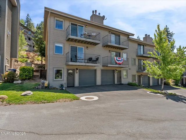 a bedroom with bed and wooden floor