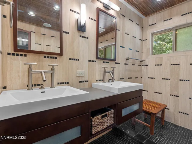 a view of a chair and tables in the balcony