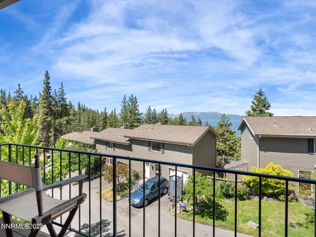 a view of multiple house with yard