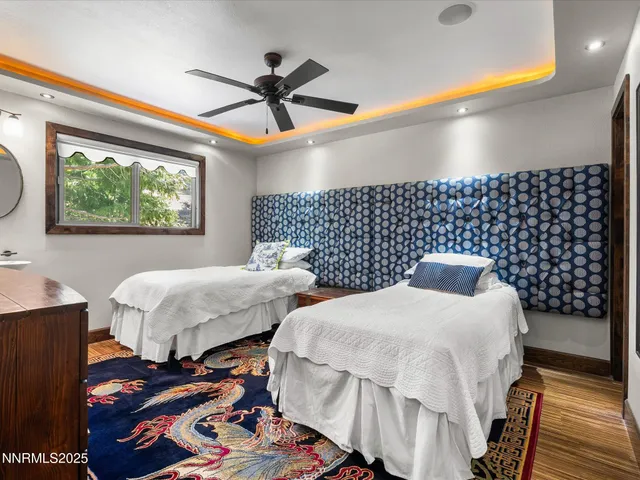 a aerial view of a house with a yard and sitting area