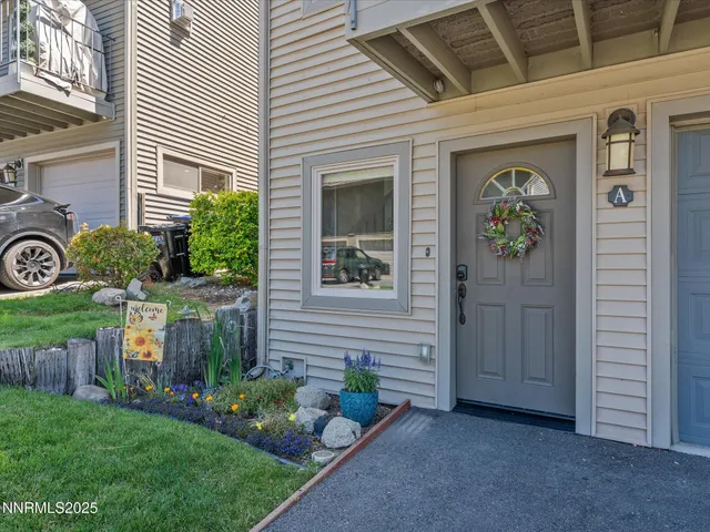 a view of a livingroom with furniture and staircase