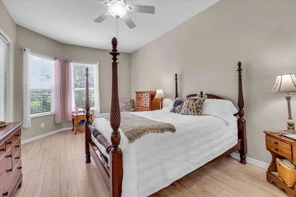 a bedroom with bed and window