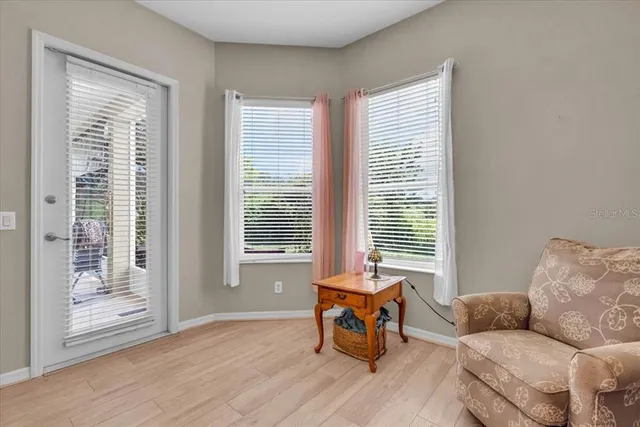 a living room with furniture and a window