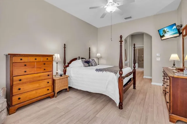 a bed room with a bed and a mirror