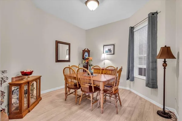 a dining room with furniture and window