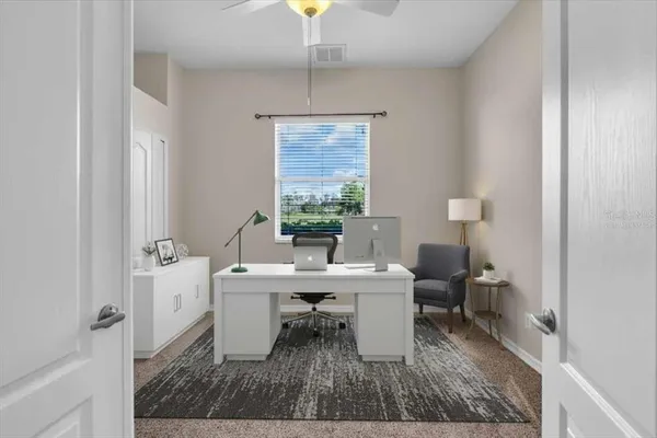 a dining room with a table and chairs