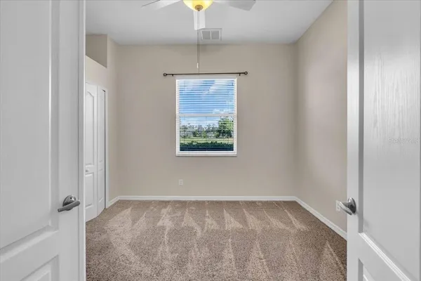 a view of an empty room with a window