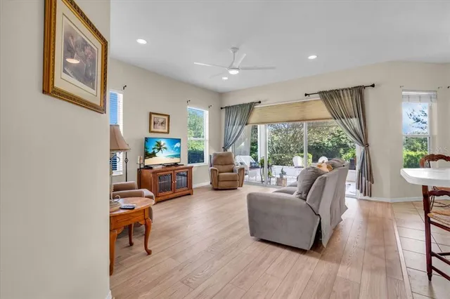 a living room with furniture and a large window
