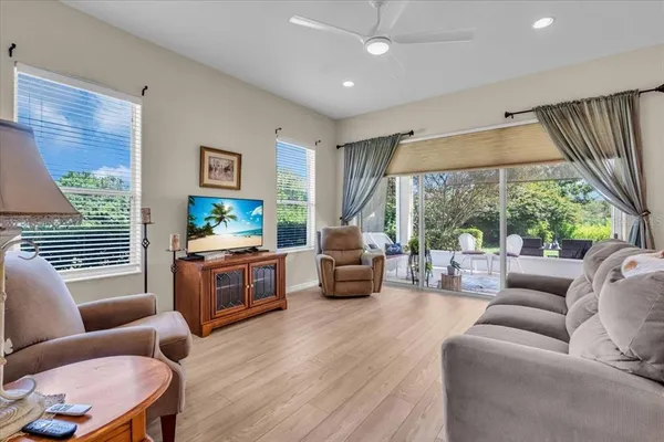 a living room with furniture and a large window