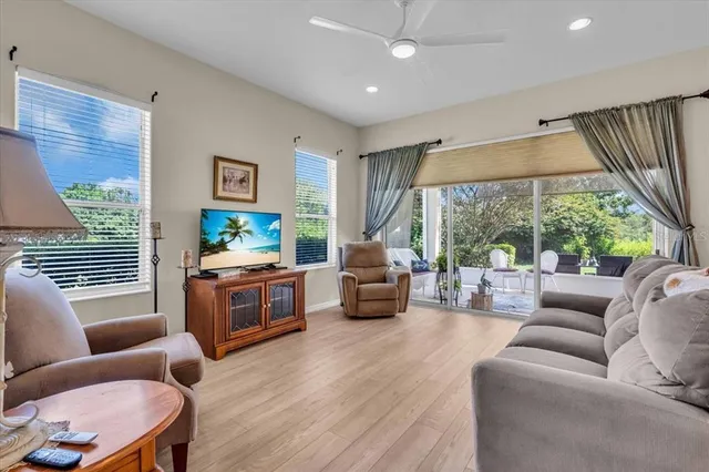 a living room with furniture and a large window