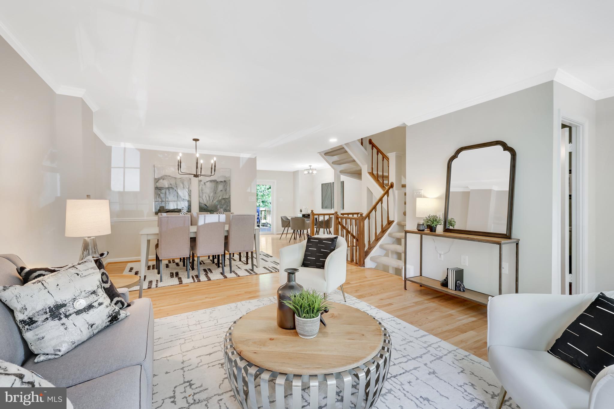 11964 Sentinel Point Court Reston, VA 20191 - Photo 11 of 68 The living room opens to the dining room.