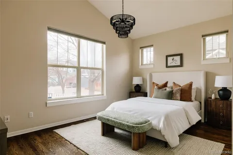 a bedroom with bed and a window