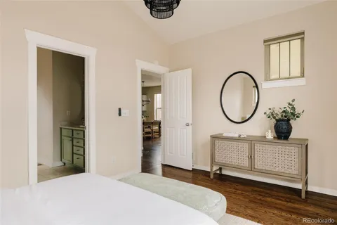 a bedroom with bed and a window