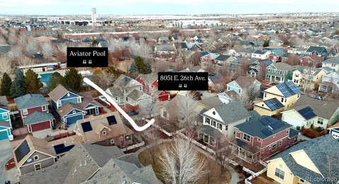 an aerial view of a building with parking space