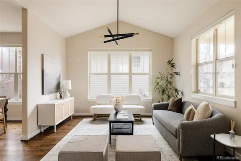 a living room with furniture and windows