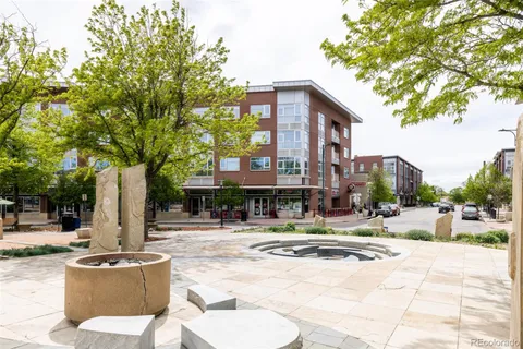 a view of a building with a garden