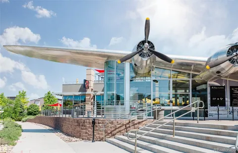 a view of a building with sitting area
