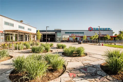 a view of a swimming pool and outdoor seating