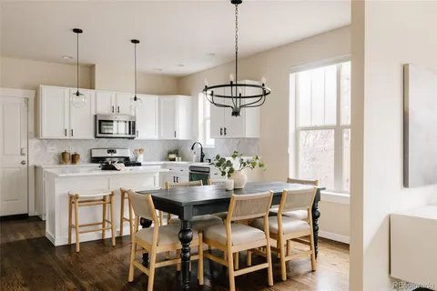 a view of kitchen with microwave and window