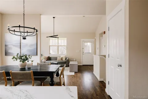 a view of a dining room with furniture window and wooden floor