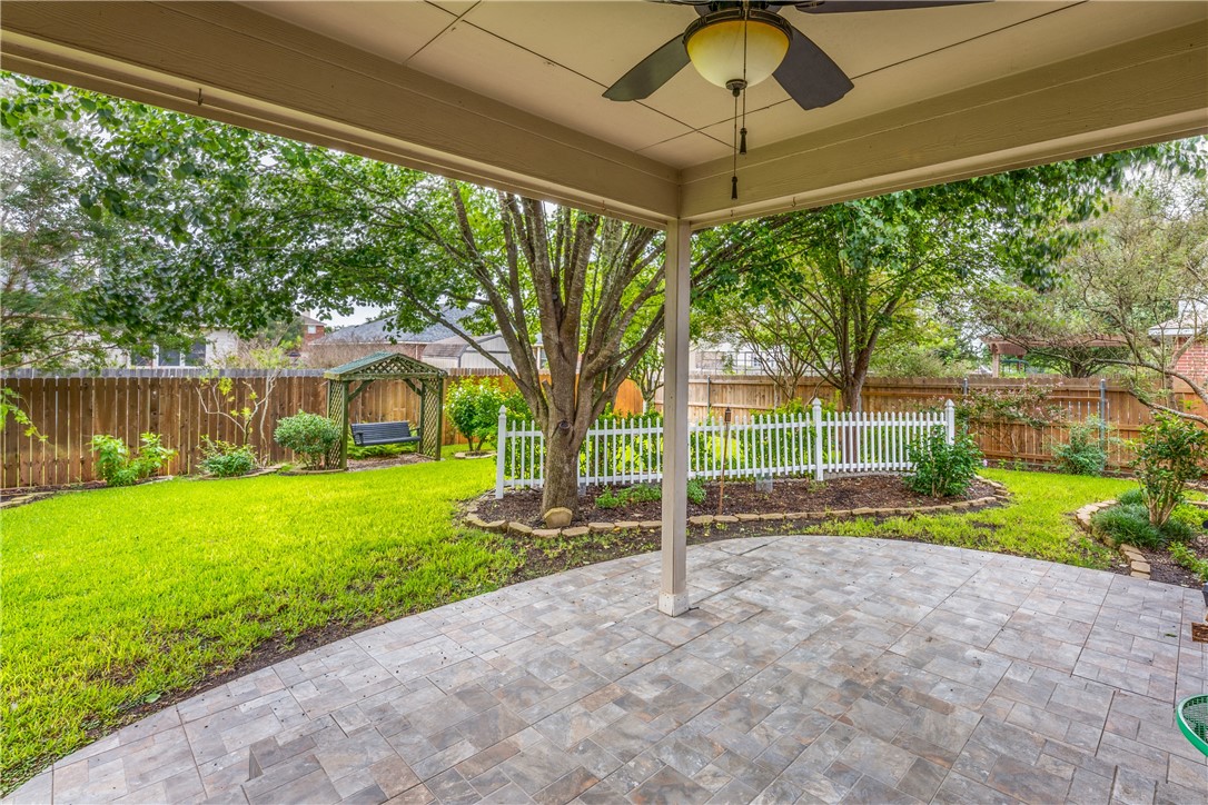 114 Inman Drive Hutto, TX 78634 - Photo 19 of 20 a view of a house with backyard and a garden