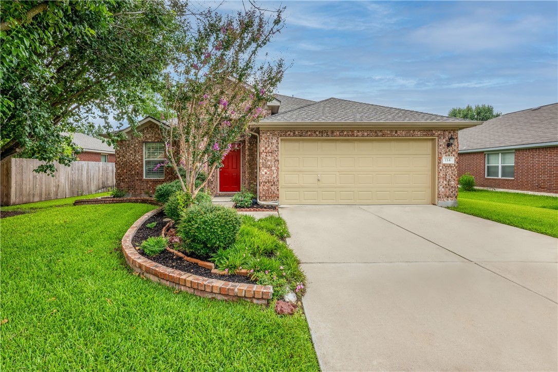 114 Inman Drive Hutto, TX 78634 - Photo 2 of 20 a front view of a house with garden