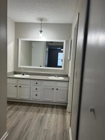 a view of a dresser with mirror