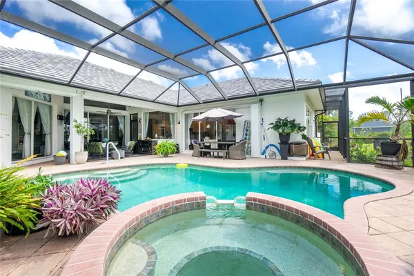 a view of a swimming pool with a patio
