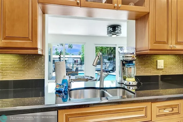 a kitchen with a sink and a window