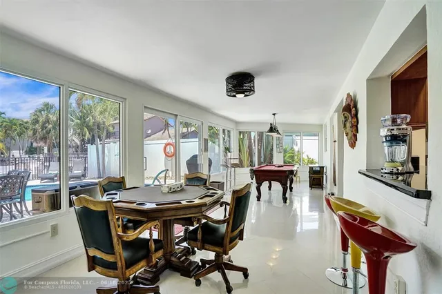 a view of a dining room with furniture and window