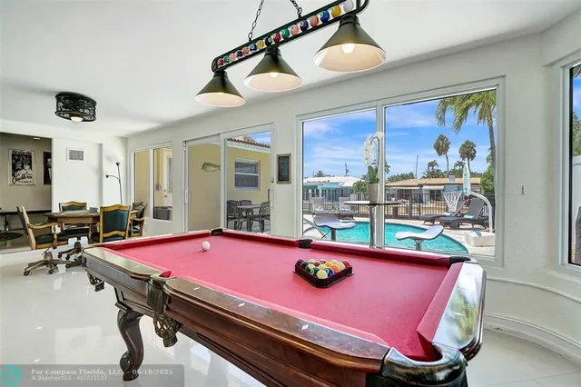 a room with gym equipment and large window