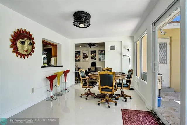 a living room filled with furniture and a chandelier