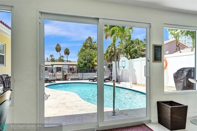 a view of living room with furniture and a large window
