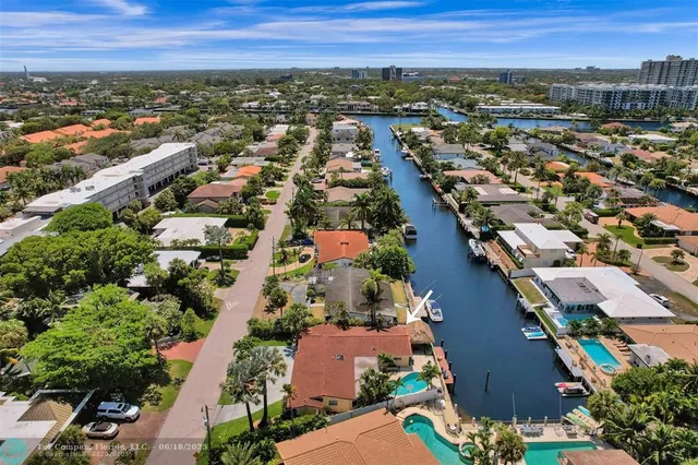 an aerial view of residential houses with outdoor space