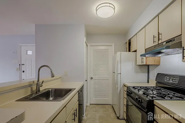 a kitchen with a stove and a sink