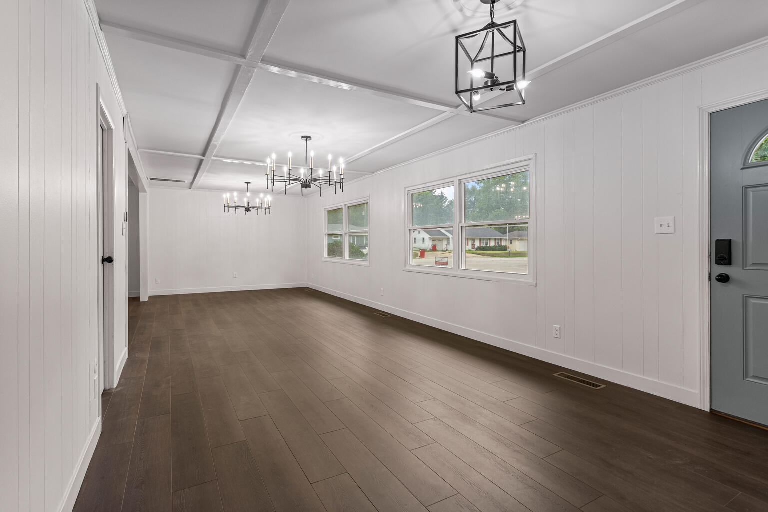 1802 Meadow Drive Champaign, IL 61821 - Photo 11 of 30 en empty room with wooden floor chandelier and windows