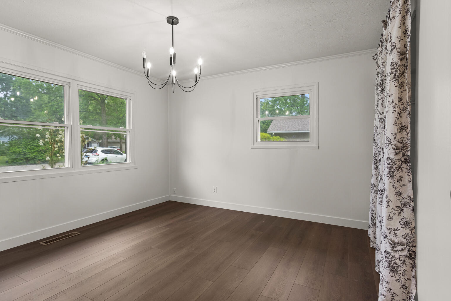 1802 Meadow Drive Champaign, IL 61821 - Photo 14 of 30 wooden floor in an empty room with a window