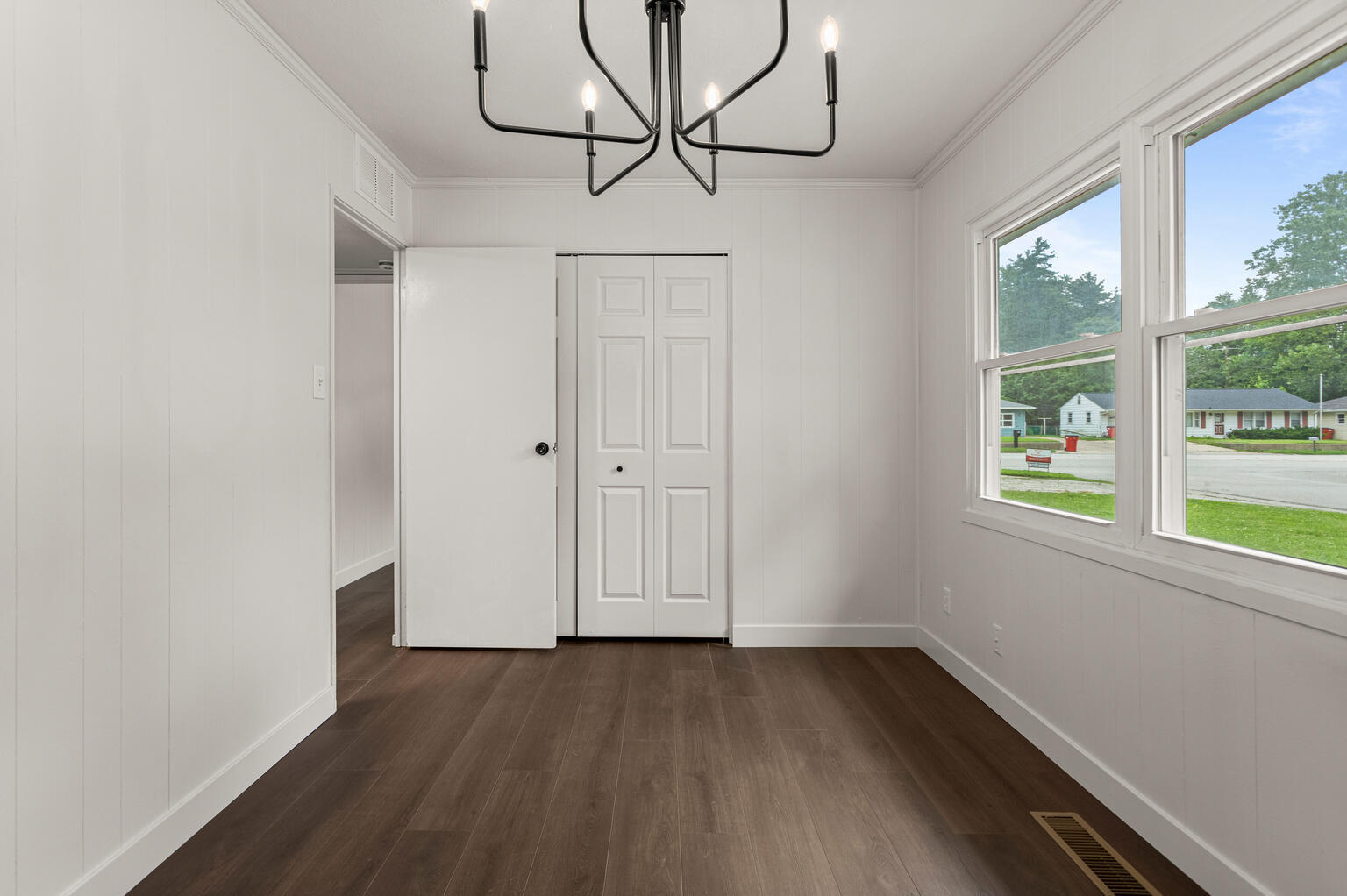 1802 Meadow Drive Champaign, IL 61821 - Photo 20 of 30 a view of empty room with wooden floor and fan