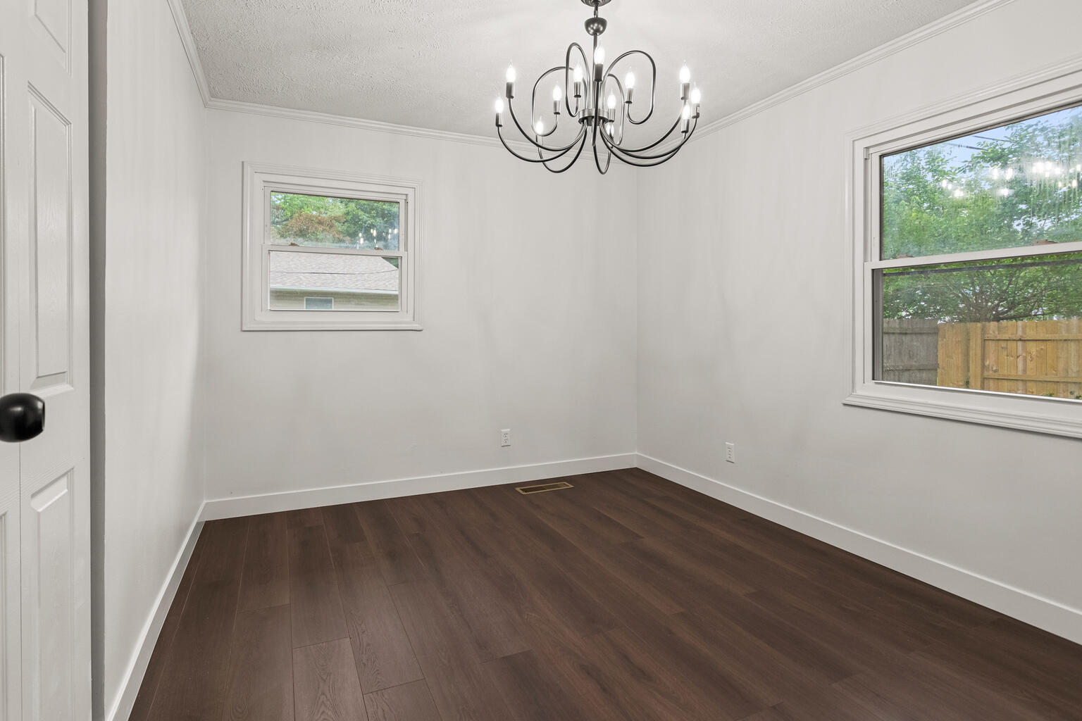 1802 Meadow Drive Champaign, IL 61821 - Photo 21 of 30 a view of empty room with wooden floor and window