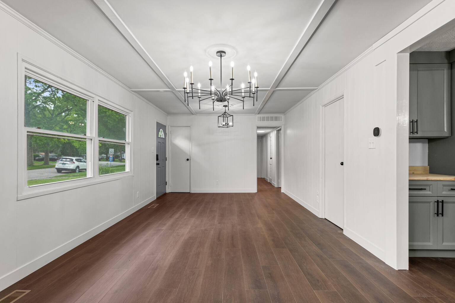 1802 Meadow Drive Champaign, IL 61821 - Photo 9 of 30 a view of a livingroom with wooden floor and windows