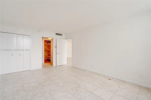 a view of bathroom with a sink and a mirror