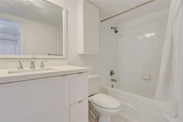 a view of a kitchen from the hallway