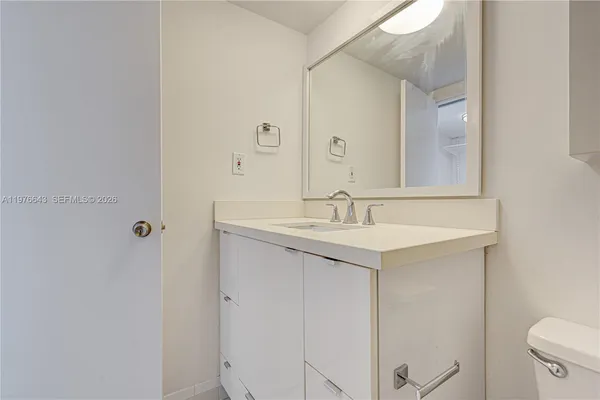 a kitchen with a refrigerator and a stove