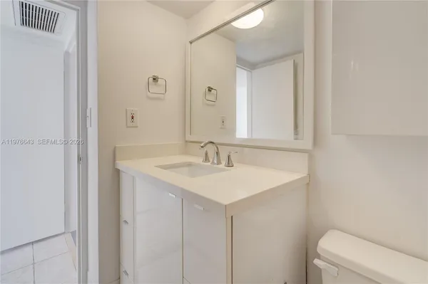 a view of a bathroom with a glass shower door